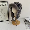 Detail of winter trapper hat with plaid pattern and soft faux fur lining for warmth - M(56-58cm) / Navy Blue