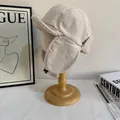 Winter thermal beige aviator hat with faux fur lining and windproof earflaps on stand - M(56-58cm) / Off White