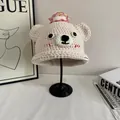 Close-up of handmade cream crochet bear hat with cute pink and yellow cake details - M(56-58cm) / Hand Crochet Bear Shape (White) / White