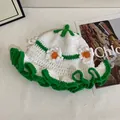 Handmade crochet bucket hat with floral knit patterns and green scalloped brim for women - M (56-58cm) / Green
