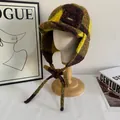 Detail showing plush plaid checkerboard texture and leather strap on winter earflap hat - M(56-58cm) / Yellow Green Brown Color Block Plaid