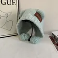 Close-up of mint green plush hat featuring fluffy bear ears and pompom chin straps - M (56-58cm) / Lake Blue