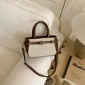 Chic beige canvas and brown leather crossbody bag on a cozy minimalist sofa setting - Brown