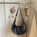 Minimalist black crescent hobo shoulder bag in textured leather with silver zipper details - No Pendant / Black
