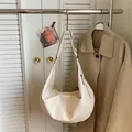 Creamy beige crescent moon shoulder bag in polished faux leather with adjustable strap - No Pendant / Off White