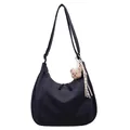Dark blue canvas hobo bag with a plush bear charm and spacious shoulder strap design - Blue with Pendant