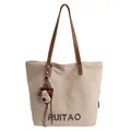 Sac fourre-tout en toile beige avec poignées brunes et un charmant pendentif en peluche - Avec Pendentif / Blanc Cassé
