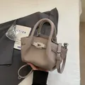 Taupe lychee grain leather handbag with silver twist lock and adjustable shoulder strap - Grey without Pendant