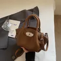 Brown lychee texture leather shoulder bag with silver turn-lock and adjustable strap - Brown