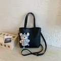 Detail of black lychee texture tote bag with a cute bear plush keychain accessory - With Pendant / Black