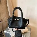 Elegant black lychee grain leather bucket bag with top handles and adjustable shoulder strap - No Pendant / Black