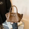Brown lychee pattern leather bucket bag with silver twist lock and shoulder strap - No Pendant / Coffee