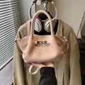 Pink bucket bag with lychee texture featuring metal buckle and adjustable strap - No Pendant / Pink