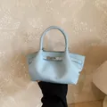 Light blue lychee grain leather bucket bag with silver lock and top handle - No Pendant / Blue
