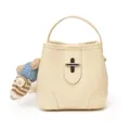 Creamy white bucket bag in lychee leather with a cute bear charm and silver lock - With Pendant / Off White