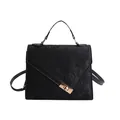 Chic black textured crossbody handbag with golden clasp lock for minimalist styling - Black
