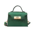 Green snakeskin textured mini crossbody bag with golden metal lock and top handle - Green