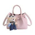 Pink faux leather bucket bag with decorative buckle strap and a cute bear charm - Pink With Pendant