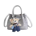 Silver bucket bag with metallic finish featuring a cute teddy bear charm and strap - Silver with Charm