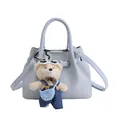 Light blue bucket bag with leather strap and a cute teddy bear charm pendant - Blue with Pendant