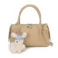 Minimalist light khaki leather handbag with plush bunny pendant shown in full front view - With Bunny Pendant / Khaki