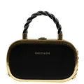 Close-up of black leather handbag with gold metal frame and woven handles detail - Black
