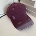 Detailed view of distressed burgundy cotton baseball cap with vintage frayed brim effects - M (56-58cm) / Deep purple