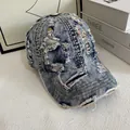 Close-up of distressed denim baseball cap showing torn details and colorful stitching - M (56-58cm) / Light Blue/Colorful Lines