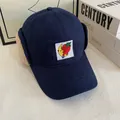 Detailed view of winter aviator hat with warm lamb wool lining and cartoon embroidery - M(56-58cm) / Navy Blue