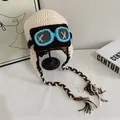 Chic cream knit pilot aviator hat with goggles and braided tassels on a stand - M / Off White