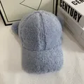 Detailed close-up of light blue faux shearling fabric and cute round ear decor on the cap - M (56-58cm) / Blue