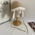 Detail of khaki aviator hat with plush white faux fur lining and chin straps - M (56-58cm) / Khaki