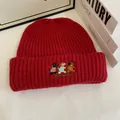 Macro detail of red ribbed knit beanie featuring cute puppy embroidery and text - M (56-58cm) / Red