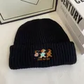 Close-up of three dogs embroidery and 'JOIN MY JOY' text on black ribbed knit beanie - M / Black