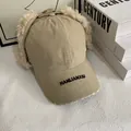 Detail of khaki winter aviator hat featuring plush ear flaps and brand embroidery on the brim - M (56-58cm) / Khaki
