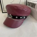 Detail of burgundy PU leather baker boy hat featuring silver anchor charm and chain links - M (56-58cm) / Burgundy