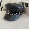Detail of black PU leather baker boy hat with silver anchor emblem and chain - M (56-58cm) / Black