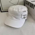 Detail of white cotton flat top military cap with silver metal rivets and zipper accents - M (56-58cm) / White