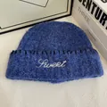 Detail of royal blue knit beanie featuring white Sweet embroidery and contrast stitching - M(56-58cm) / Blue