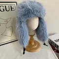 Detailed view of light blue faux fur trapper hat with warm ear flaps and buckle straps - M / Light Blue