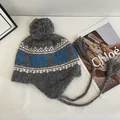Winter Fair Isle knit trapper hat with blue snowflake patterns and grey pom-pom - M / Gray