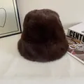 Close-up of thick dark brown plush bucket hat on a minimalist display background - M (56-58cm) / Coffee