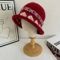 Detail of burgundy plush knit bucket hat with bohemian crochet trim and colorful woven band - M (56-58cm) / Red