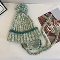 Winter mixed-color knit beanie with pompom, ear flaps and braided ties for women - M (56-58cm) / Green