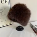 Detail view of the plush dark brown faux fur texture on a warm bucket hat for women - M (56-58cm) / Coffee