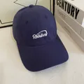 Close-up of Rainbow embroidery on a navy blue cotton baseball cap with a soft top - Navy Blue