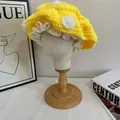 Detailed close-up of handmade crochet mushroom hat with yellow base and white polka dots - M (56-58cm) / Yellow