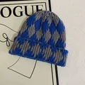 Detail of blue and gray argyle knit beanie showing thick texture and folded cuff - M (56-58cm) / Blue