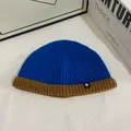Contrast color knit beanie in royal blue and brown with snowflake tag for winter warmth - M (56-58cm) / Blue