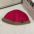 Pink and beige contrast knit beanie hat with cuff and snowflake patch on a white desk - M (56-58cm) / Rose Red